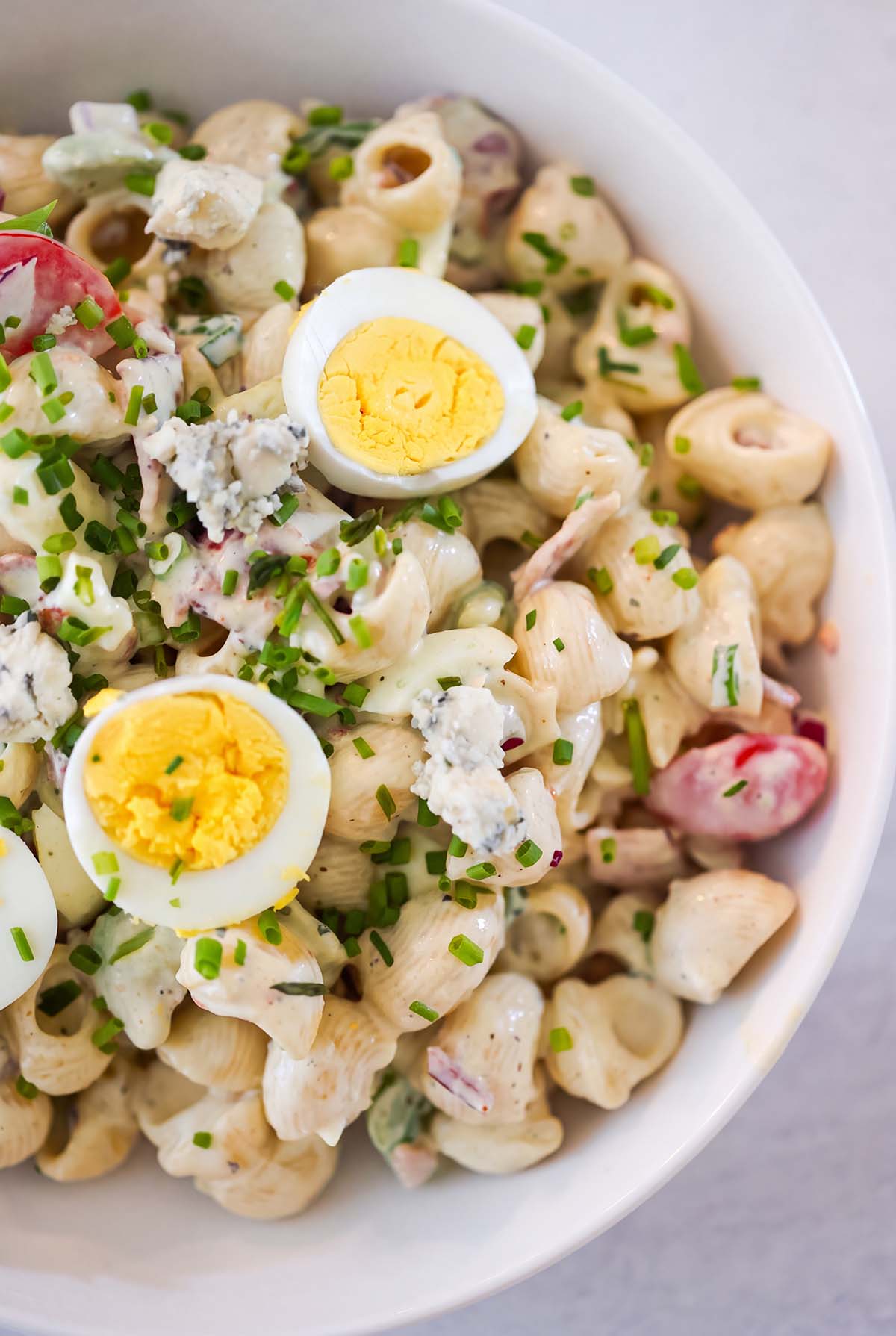 Pasta salad in a bowl up close.