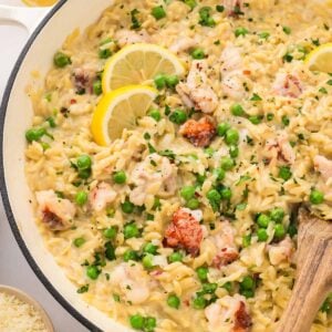 lemon garlic lobster orzo in a white skillet.