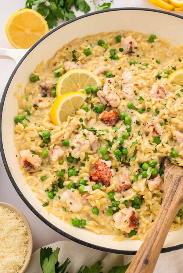 lemon garlic lobster orzo in a white skillet.