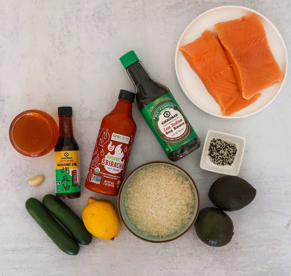 salmon, sauces, rice, avocado, honey, lemon, cucumbers, sesame seeds, and garlic.
