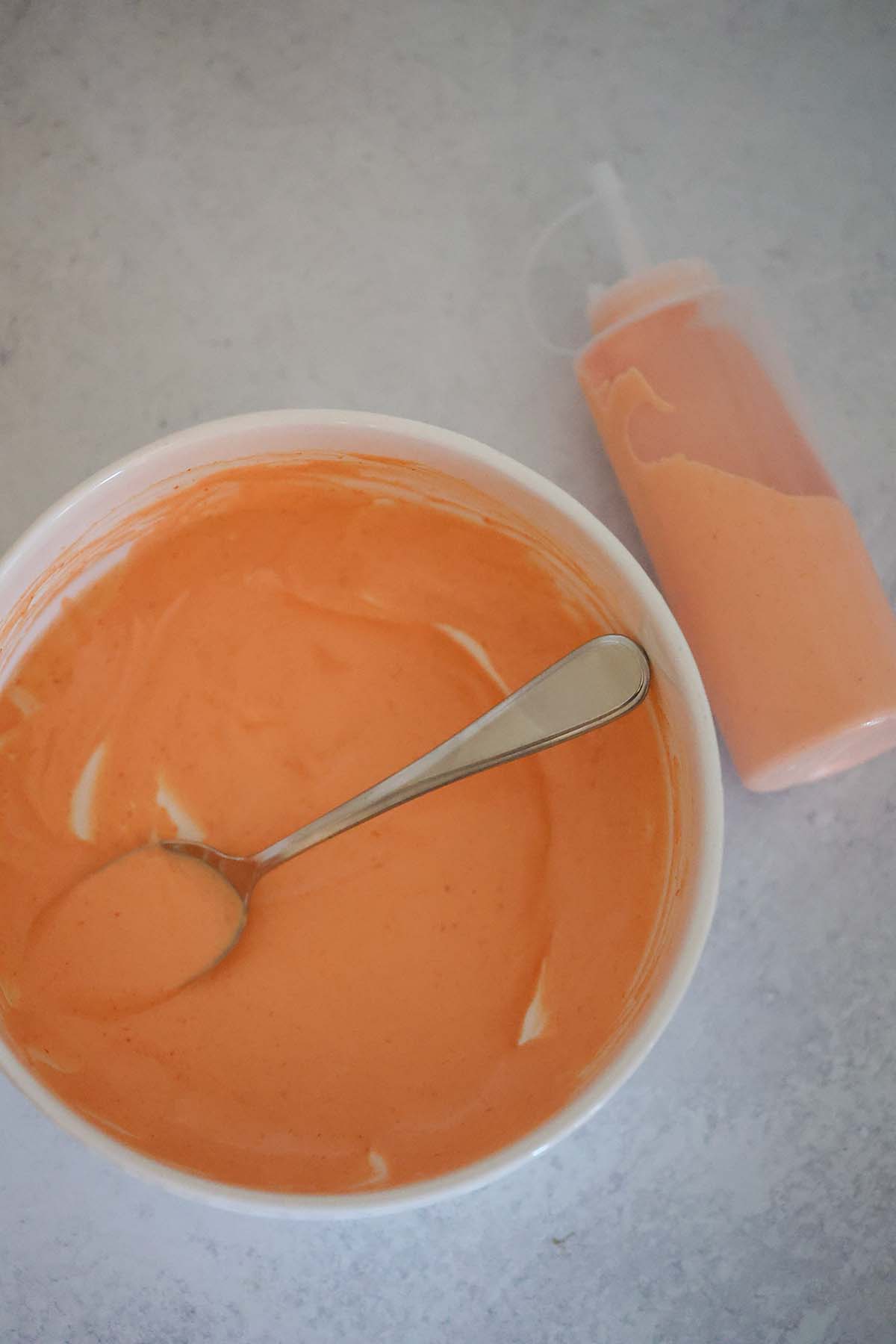 spicy mayo in a bottle and in a squeeze bottle.