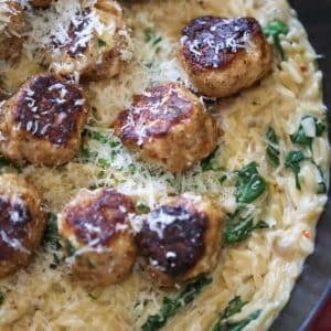 chicken meatballs over orzo.