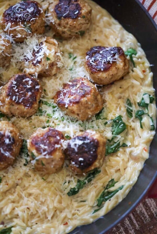 chicken meatballs over orzo.