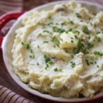 mashed potatoes with chives and butter on top.