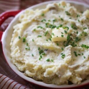 mashed potatoes with chives and butter on top.