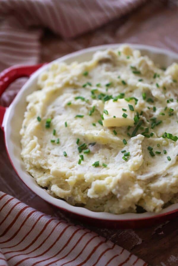 mashed potatoes with chives and butter on top.