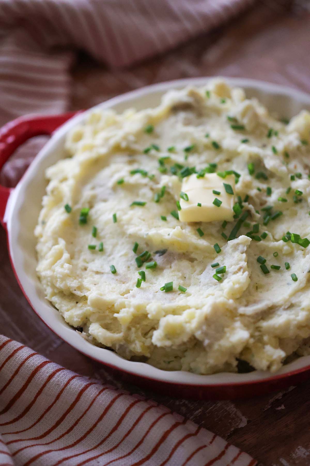 mashed potatoes with chives and butter on top.