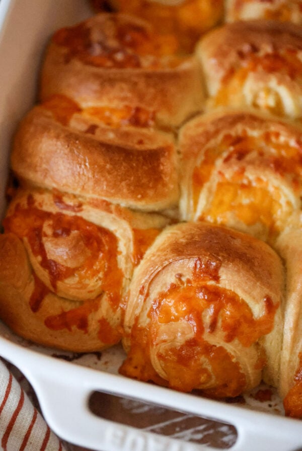 cheesy garlic rolls in a baking dish.
