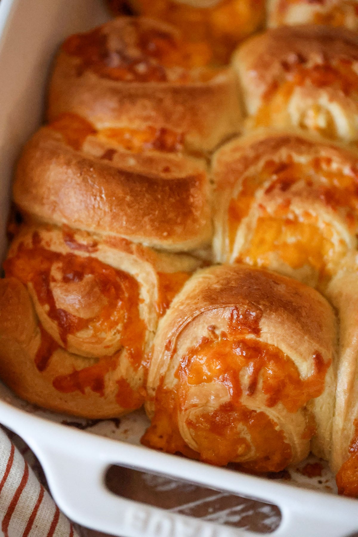 cheesy garlic rolls in a baking dish.