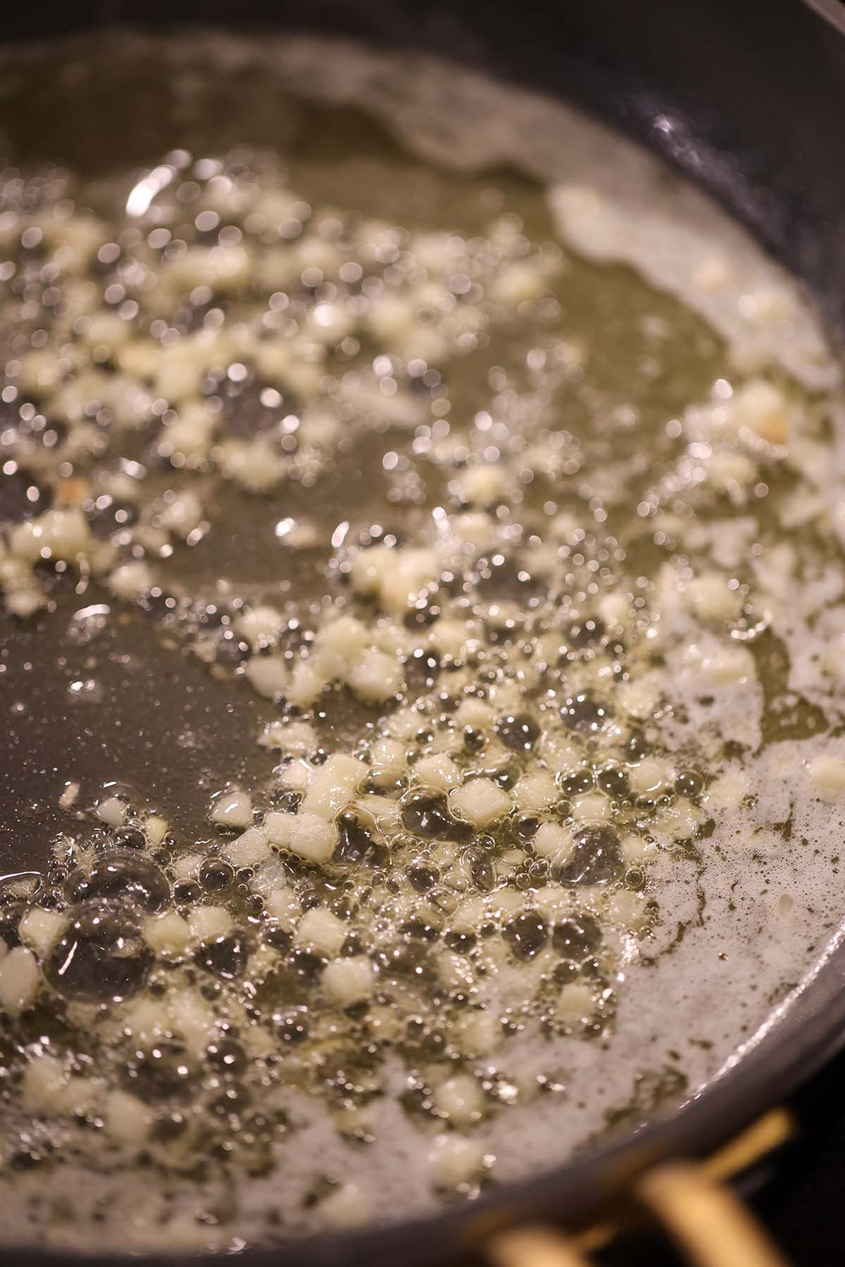 butter and garlic cooking in a skillet.