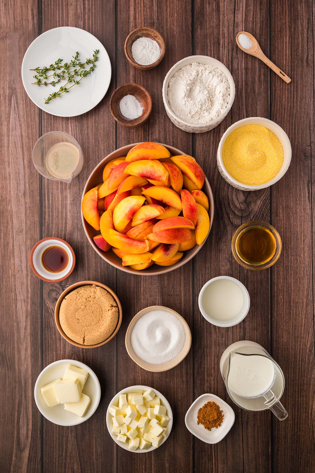 sugar, thyme, peaches, baking soda, baking powder, salt, honey, vanilla extract, flour, sugar, cornmeal, butter, cinnamon, and buttermilk.