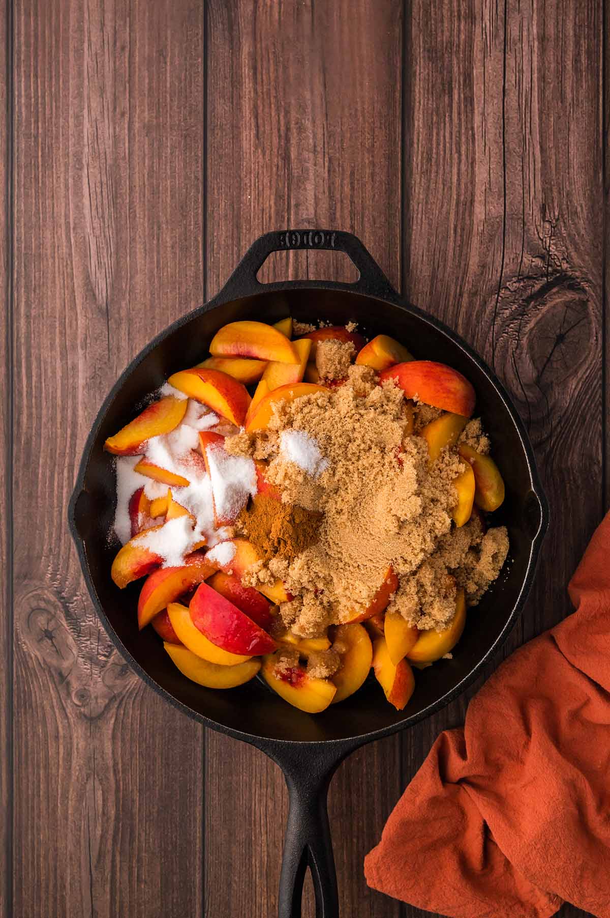 sliced peaches with brown and white sugar.