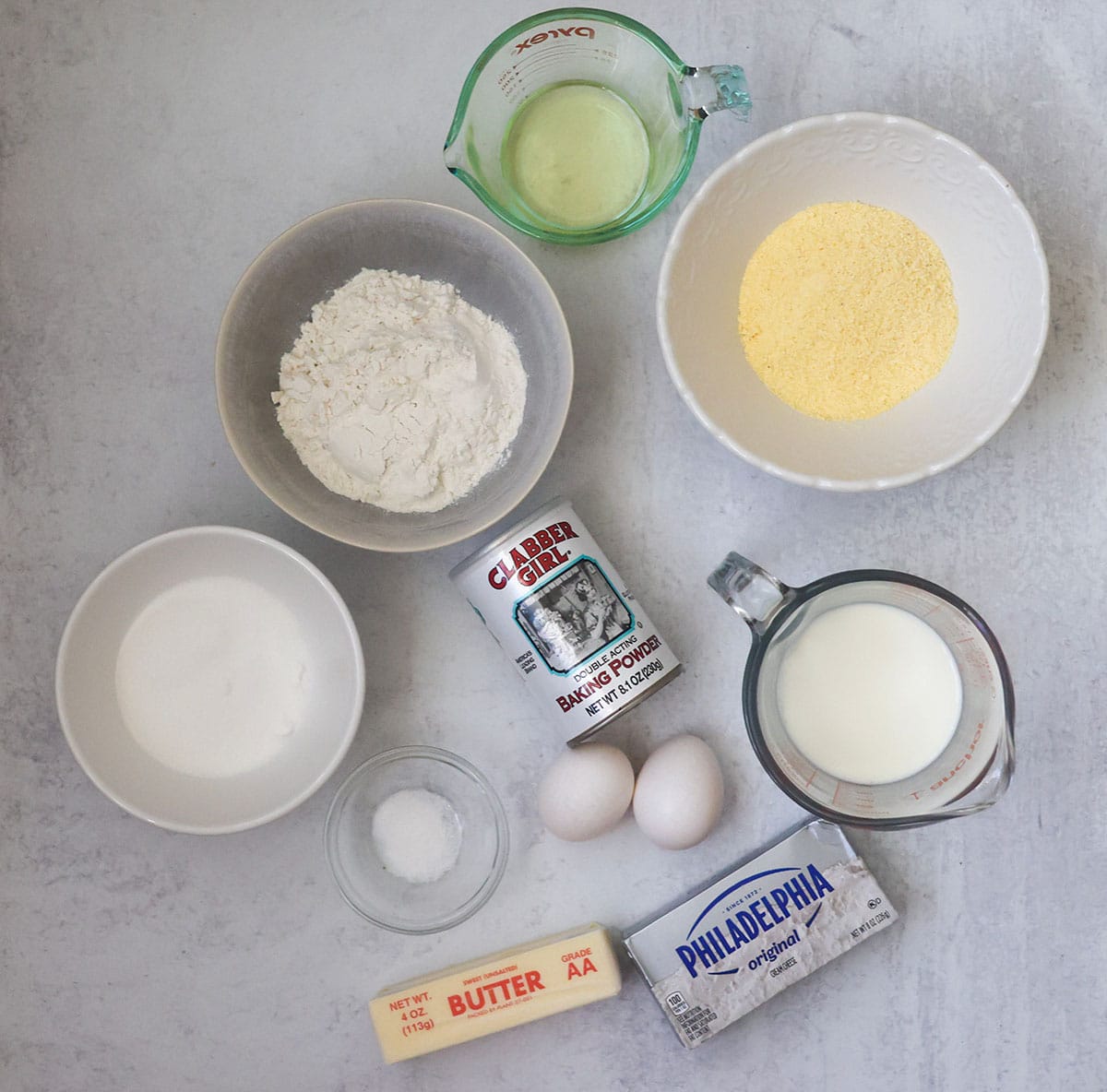 flour, cornmeal, sugar, eggs, salt, baking powder, oil, milk, and cream cheese.