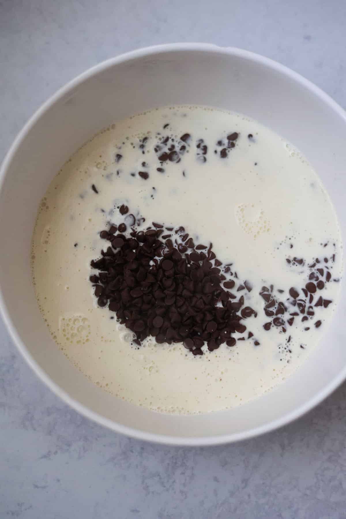 semi-sweet chocolate chips and heavy cream in a bowl.