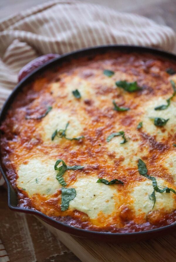 Gnocchi lasagna with fresh basil on top.
