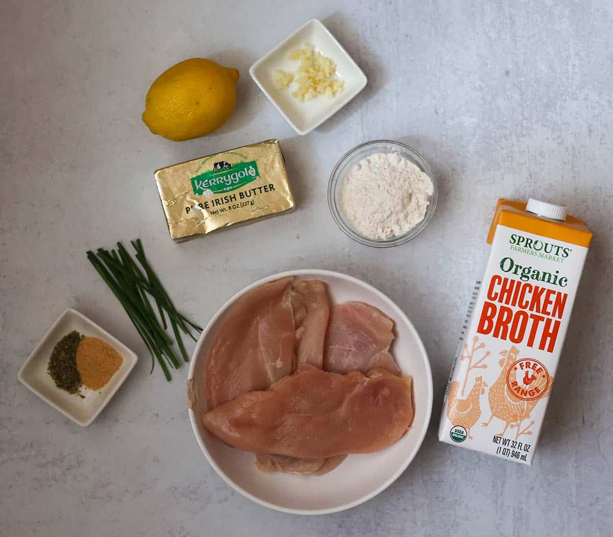 raw chicken breasts, flour, butter, lemon, garlic, chives, spices, and chicken broth.