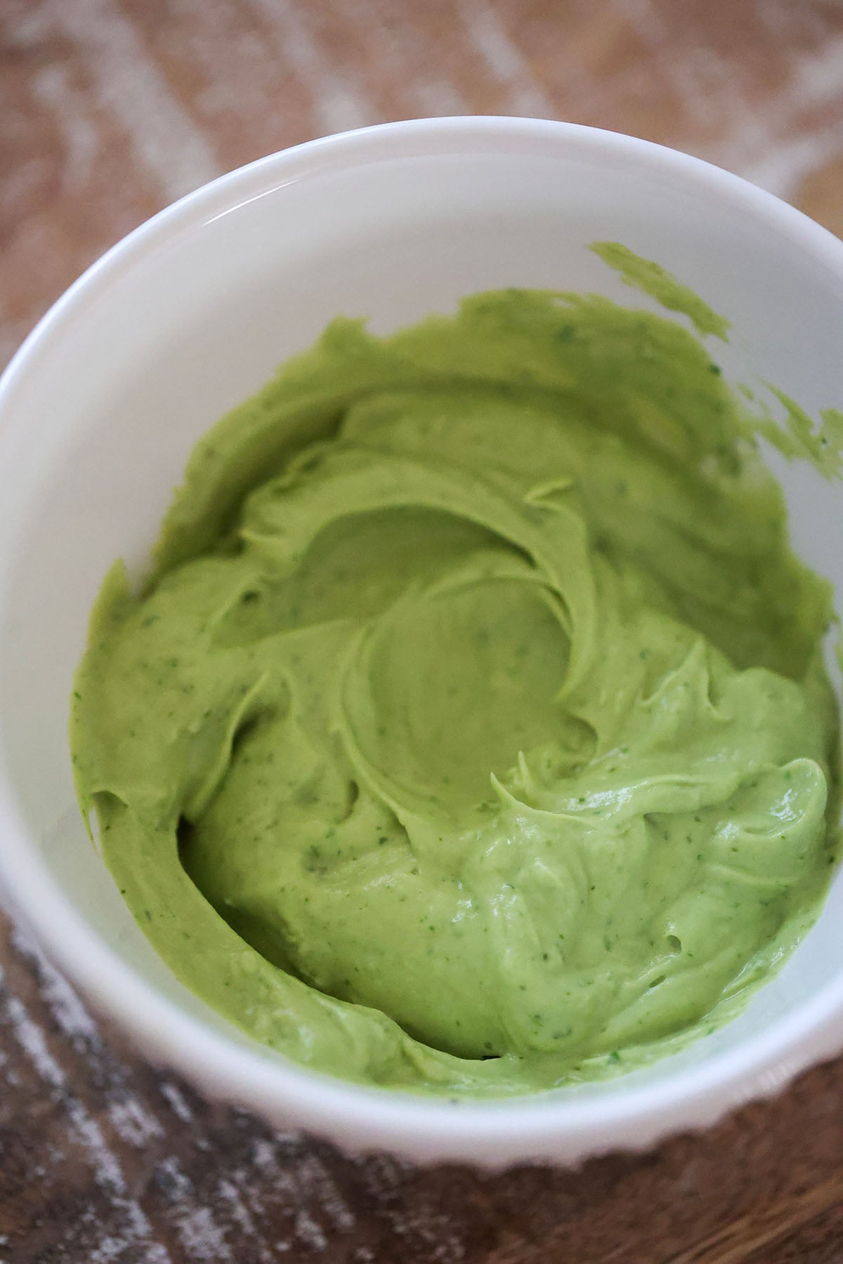 green avocado sauce in a bowl.