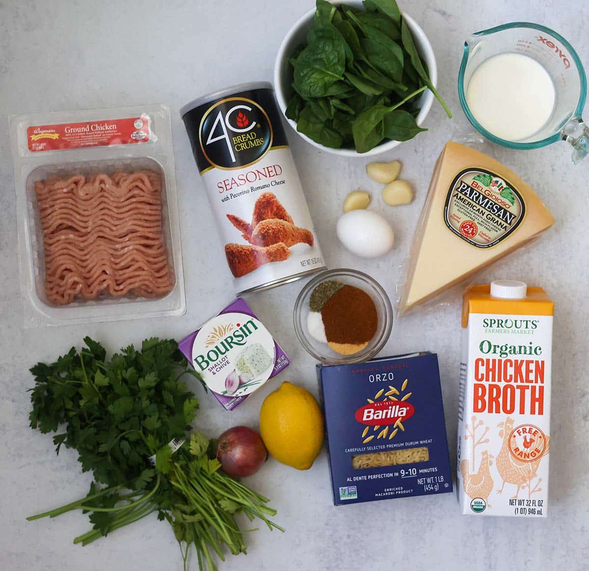 ground chicken, shallot, garlic, spices, orzo, chicken broth, cream, spinach, parsley, Boursin cheese, parmesan, lemon, and orzo.